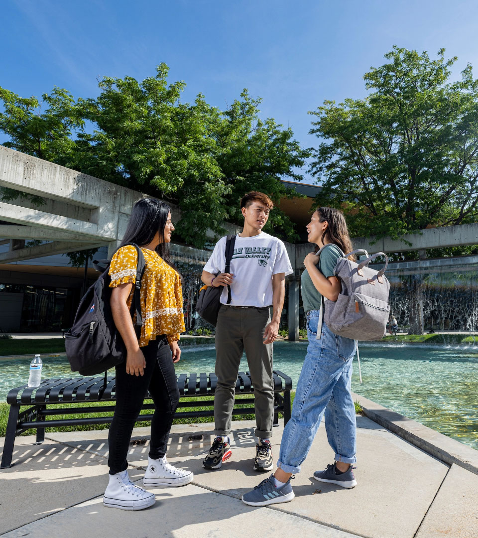 students talking in UVU quad