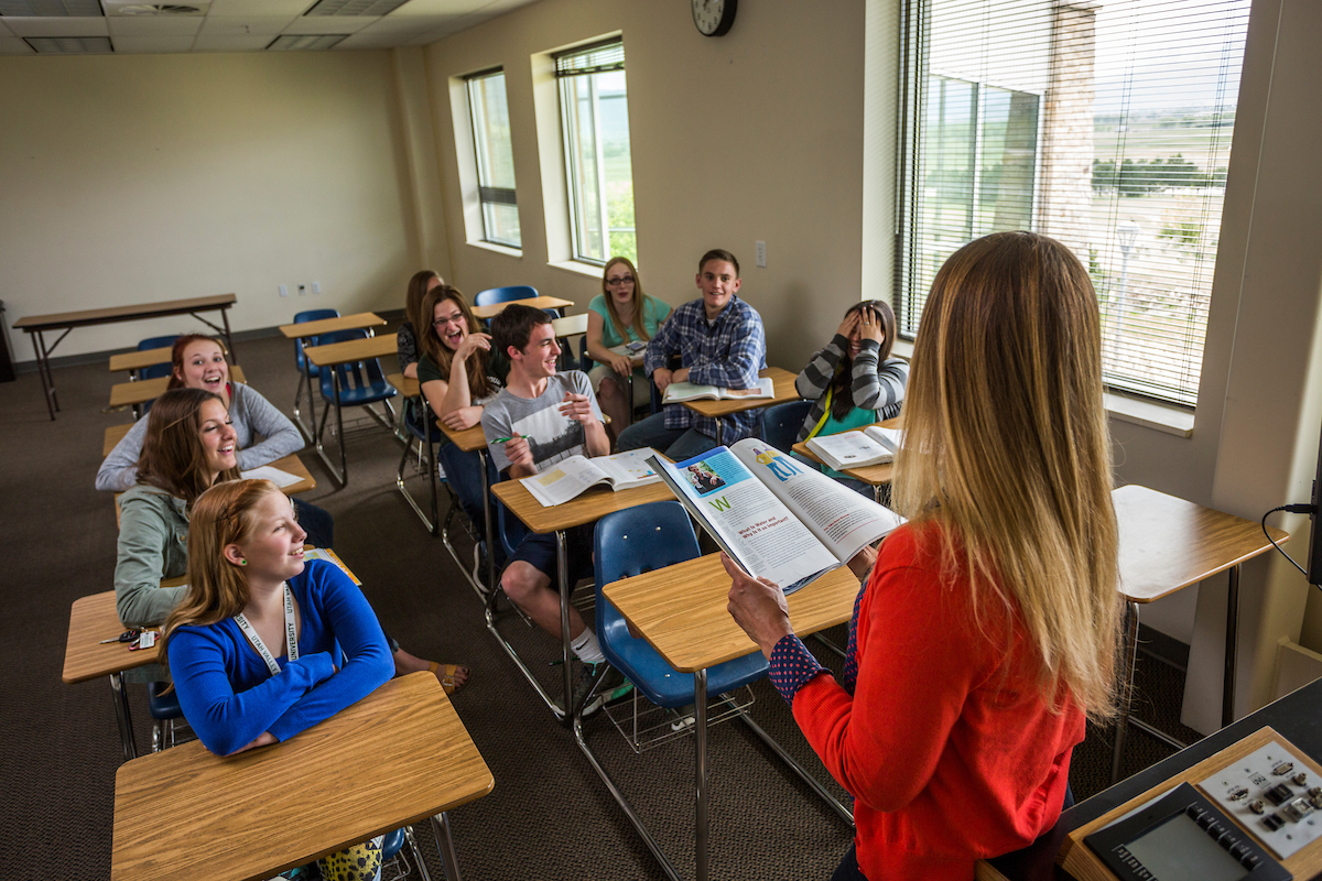 Students listening to their professor in class