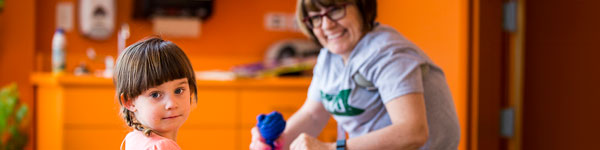 A child inside the Wee Care Childcare Center playing