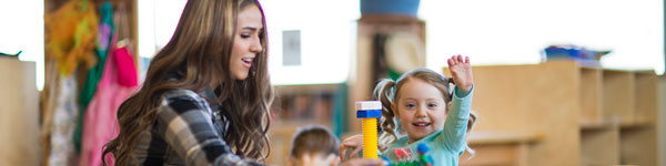 Children interacting with Wee Care teachers