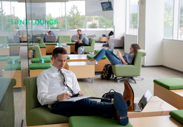 Students sitting on chairs studying in one of the many UVU lounges