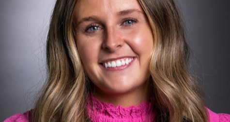 Image of Kylee Robbins smiling with a dark grey background