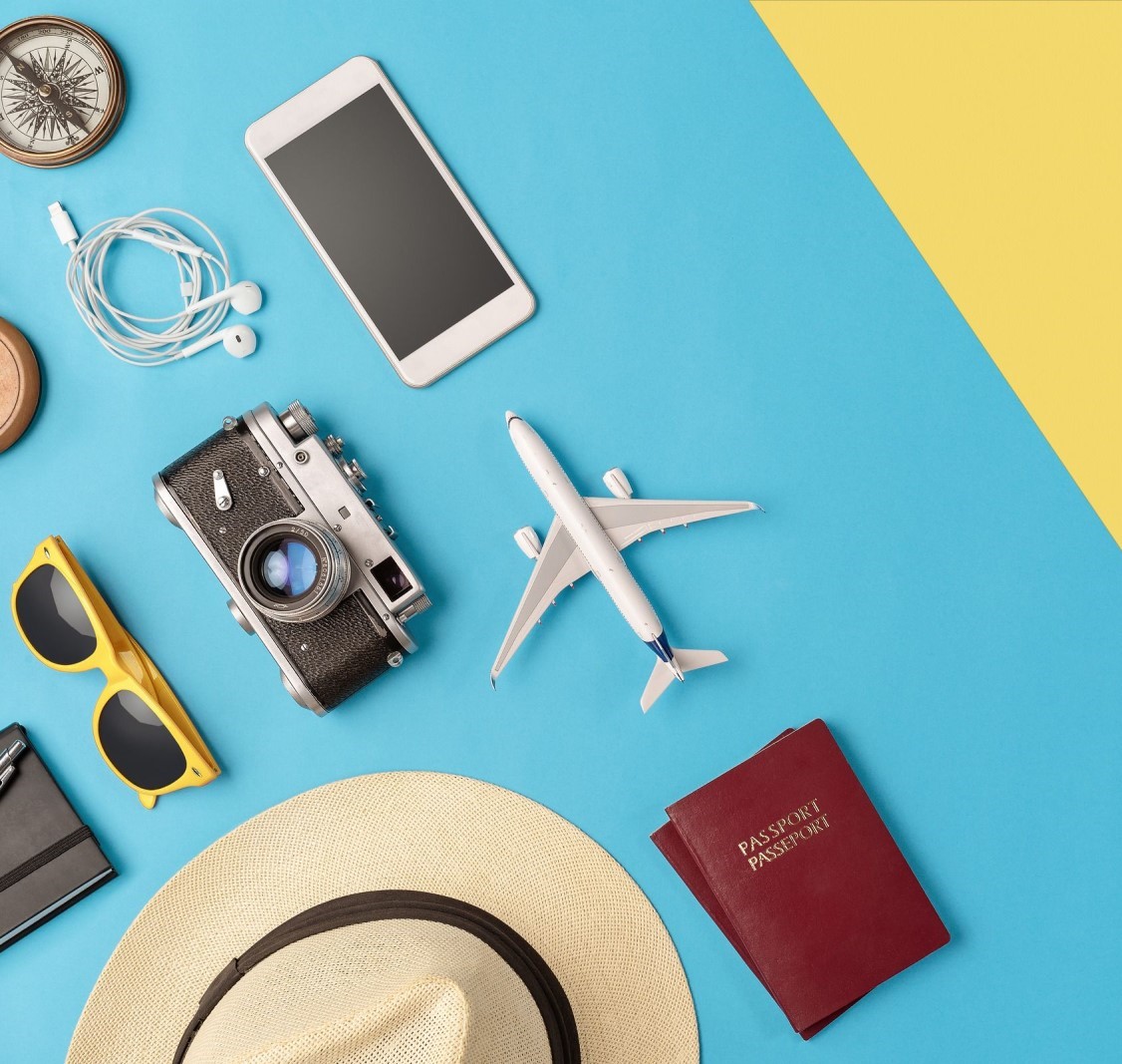 trinkets regarding travel sitting on a blue table