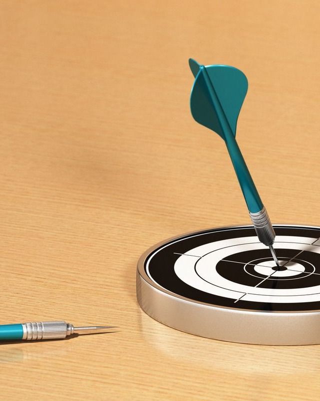 darts with small target on a table