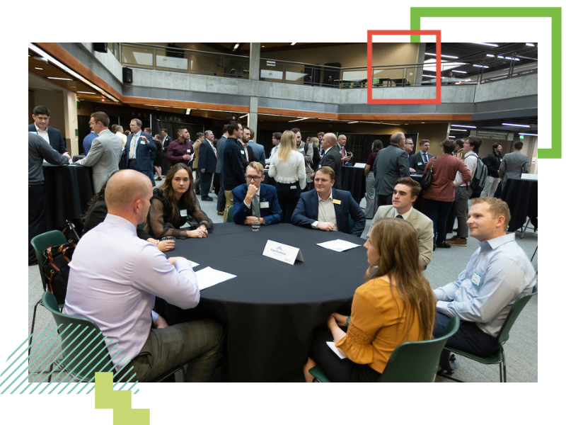 Students networking with professional at event