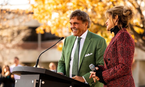 Scott Keller talking at the podium of a ceremony