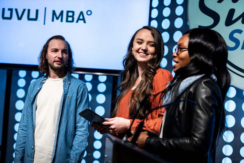 Students presenting on stage at Silicon Slopes