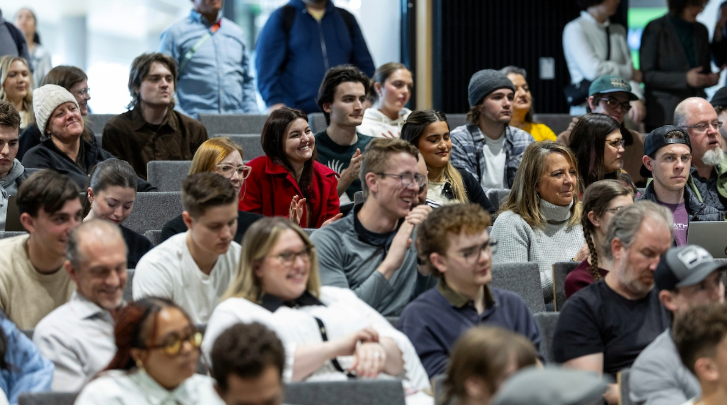Faculty sit in an auditorium 