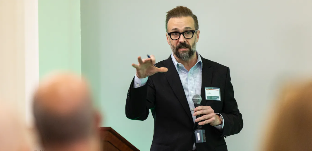 Commissioner Landward speaks to a crowd