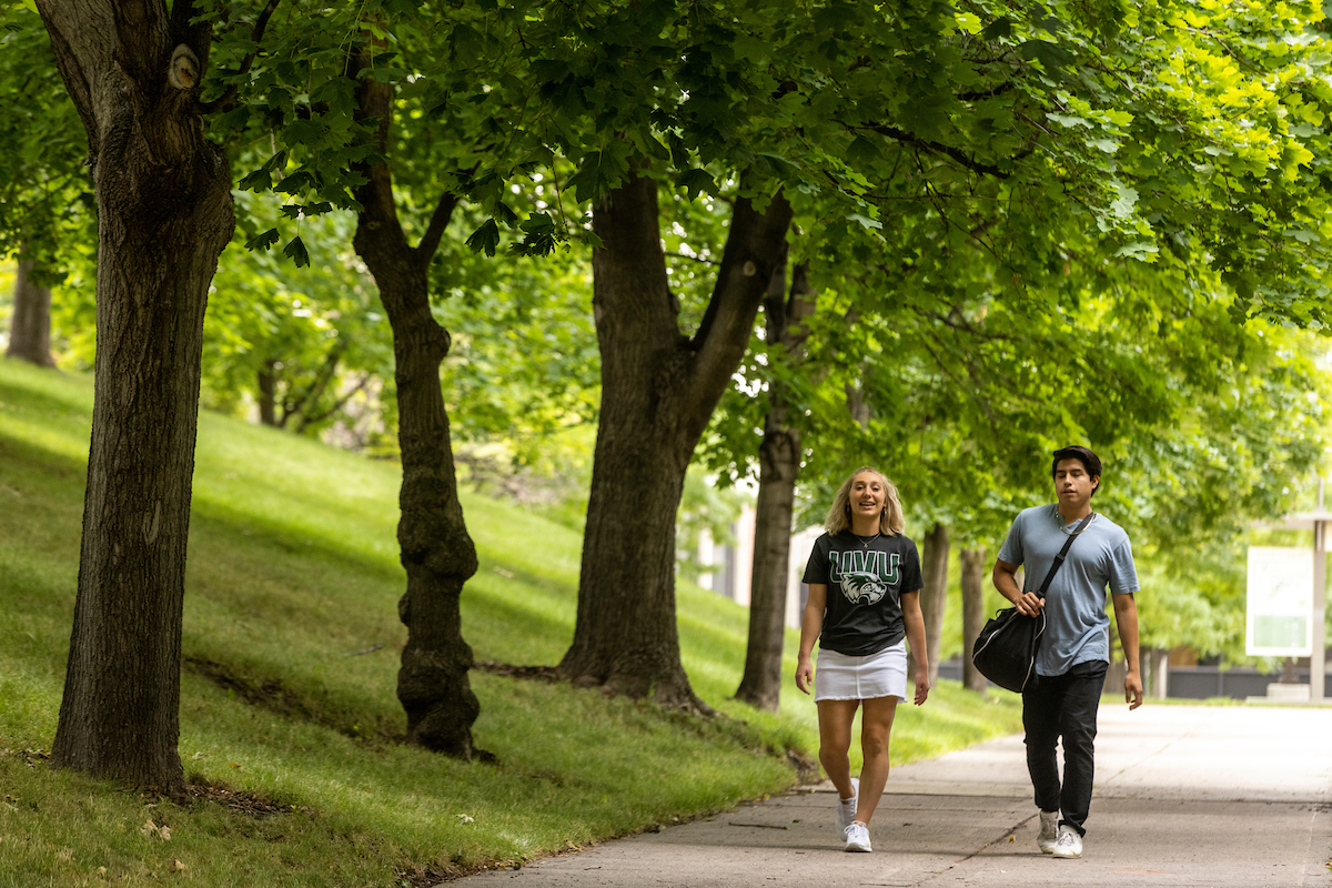 students walking outside UVU campus