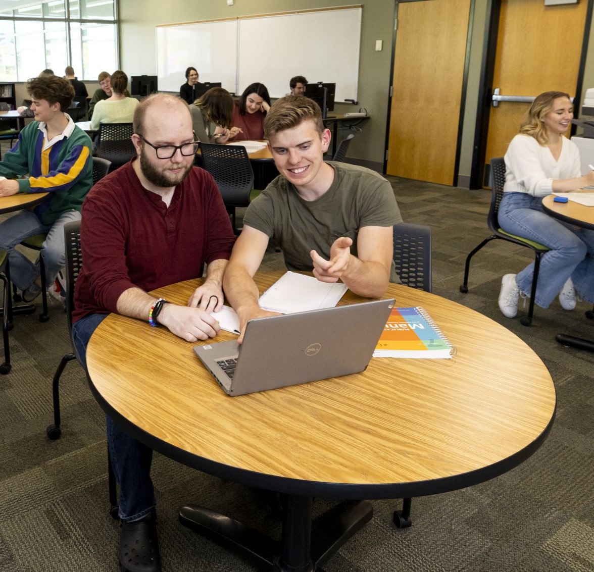 Tutor aiding a student 