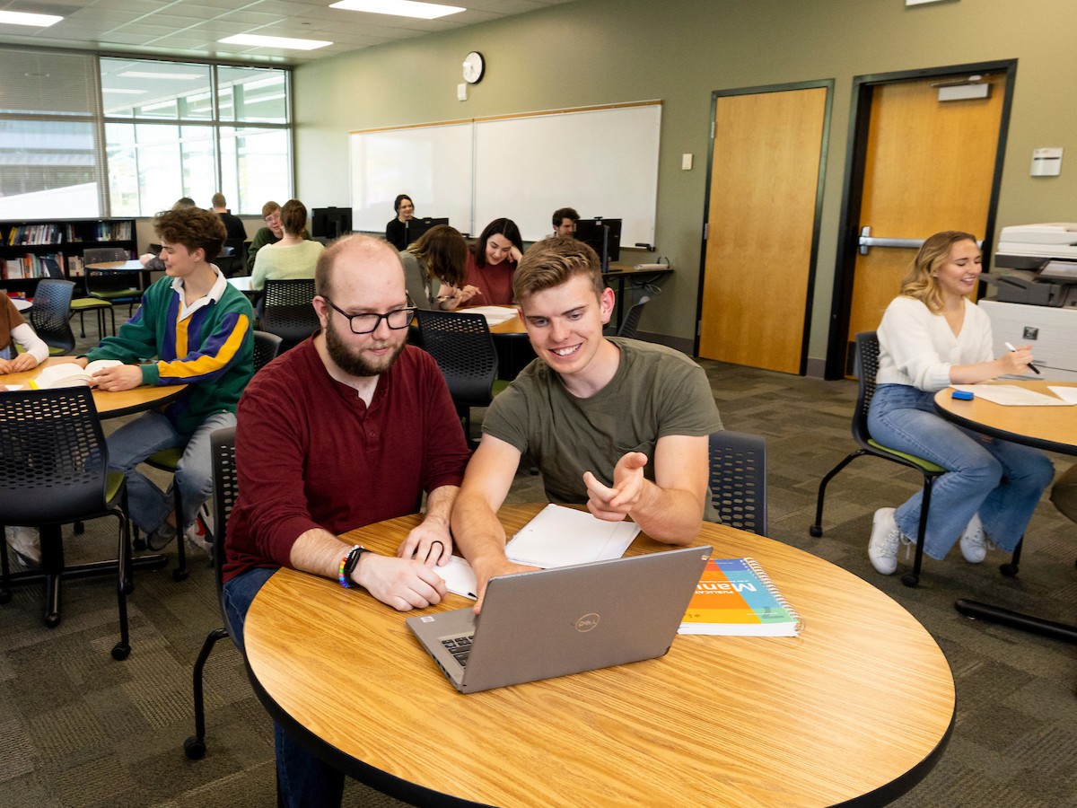 Tutor aiding a student 