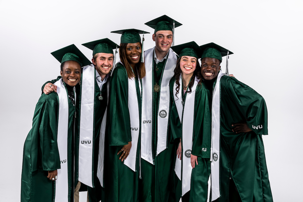 A group of UVU students in graduation caps and gowns